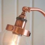 Floor lamp in aged copper finish with adjustable knuckle joint