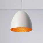 Adjustable height pendant light in white with a gold interior finish