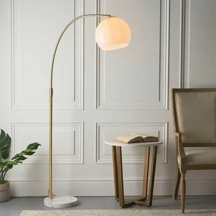 Floor lamp in brushed brass finish with opal gloss white glass shade