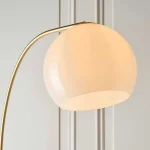 Floor lamp in brushed brass finish with opal gloss white glass shade