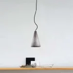 Conical shape pendant light in a sleek grey colour made from concrete