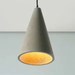 Conical shape pendant light in a sleek grey colour made from concrete