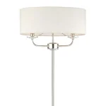 Floor lamp in bright nickel finish with vintage white faux silk shade