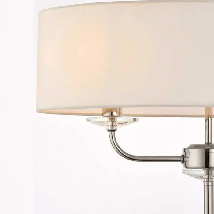 Floor lamp in bright nickel finish with vintage white faux silk shade