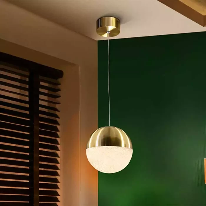 Orb pendant light in satin brass finish