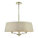 Pendant light with taupe shade in antique brass finish