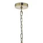 Pendant light with taupe shade in antique brass finish