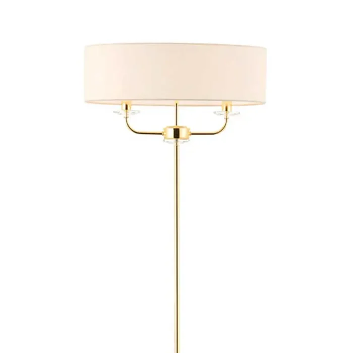 Floor lamp in polished brass finish with vintage white silk shade