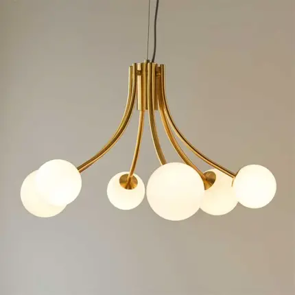 Pendant light in brushed gold finish with white glass shades