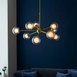 Satin brass glass pendant light in multi arm design.