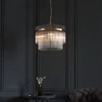 3 light pendant light in antique brass finish with clear glass