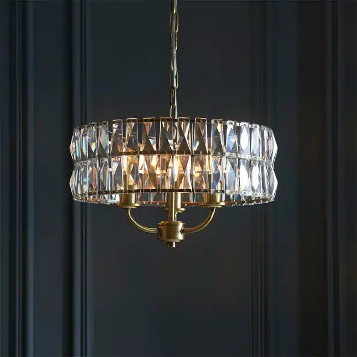 3 light pendant light in antique brass finish with clear glass