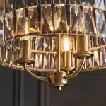 3 light pendant light in antique brass finish with clear glass