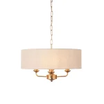 Pendant light in aged brass finish with natural linen fabric shade