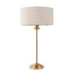 Table lamp in aged brass finish with natural linen fabric shade