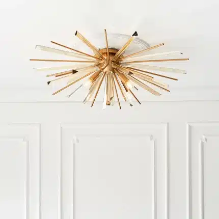 Antique brass plated flush ceiling light in starburst design for sitting room. living room and hallway