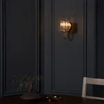 Wall light in antique brass plated finish