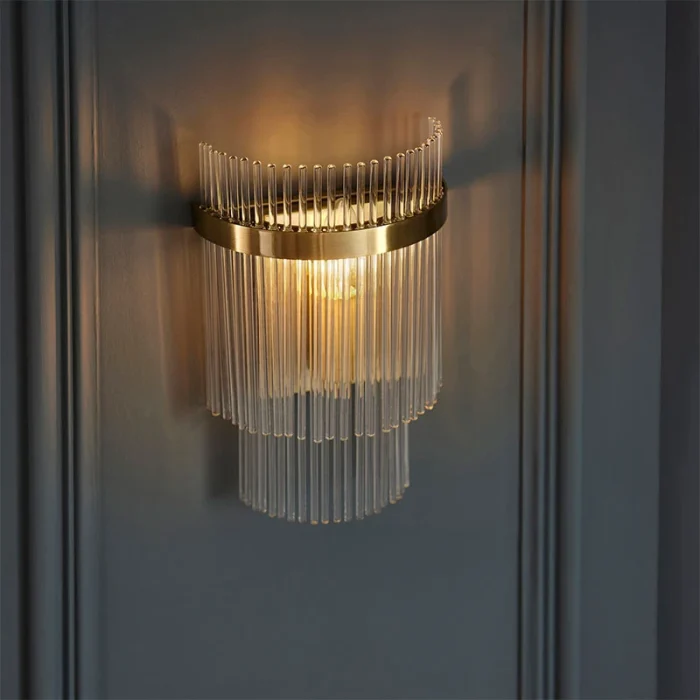 Wall light in antique brass plated finish with clear glass rods