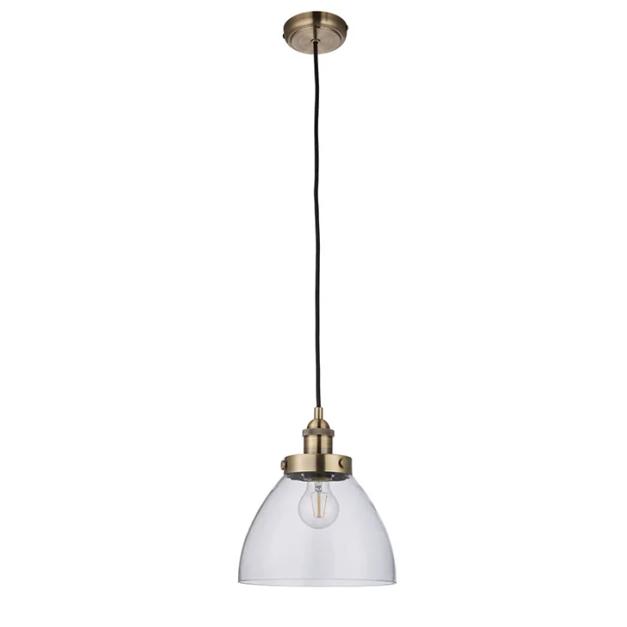 Single pendant light in antique brass finish with clear glass shade