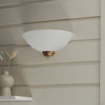 Wall light in brushed brass finish