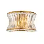 Wall light in brushed warm brass finish with clear glass