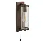 Bathroom wall light in dark bronze finish with clear glass shade