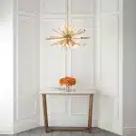 Large antique brass plated pendant light in starburst design for sitting room. living room and hallway