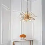 Large antique brass plated pendant light in starburst design for sitting room. living room and hallway