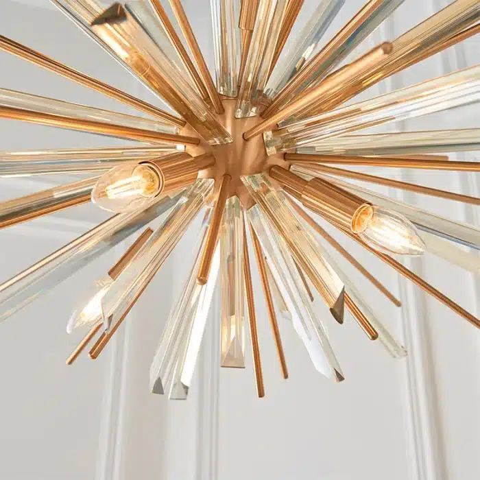 Large antique brass plated pendant light in starburst design for sitting room. living room and hallway