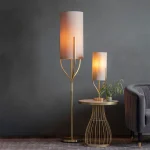 Floor lamp in satin brass finish with natural fabric shade