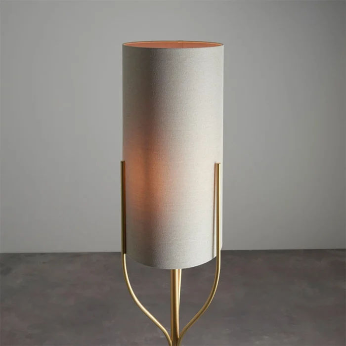 Floor lamp in satin brass finish with natural fabric shade