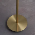 Floor lamp in satin brass finish with natural fabric shade