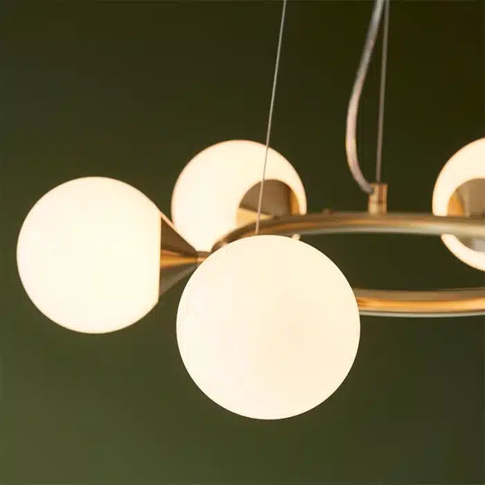 Rind design pendant light in satin brushed gold finish with gloss white glass shades