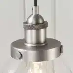 Single pendant light in brushed silver finish with clear glass shade