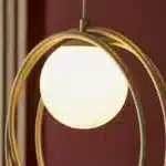 Brushed gold globe pendant light opal glass shade angle