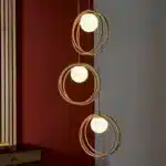 Brushed gold globe pendant light opal glass shades lifestyle