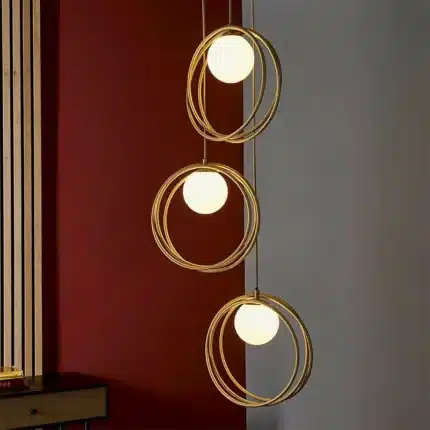 Brushed gold globe pendant light opal glass shades lifestyle
