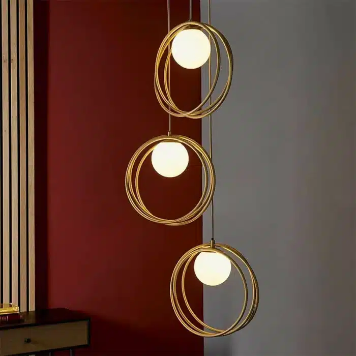 Brushed gold globe pendant light opal glass shades lifestyle