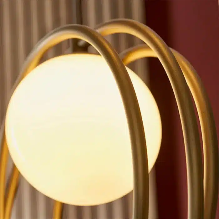 Brushed gold globe pendant light ring detailing