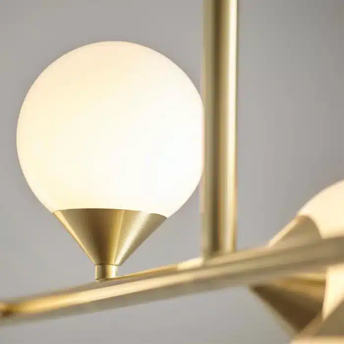 Satin brass linear pendant light with gloss opal glass shade view