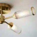 Semi flush satin brass ceiling light ribbed glass shade side angle
