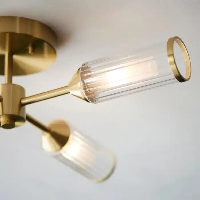 Semi flush satin brass ceiling light ribbed glass shade side angle