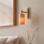 Brass marble effect wall light with linen shade facing downwards