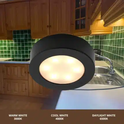 Matt black round LED under cabinet light in kitchen
