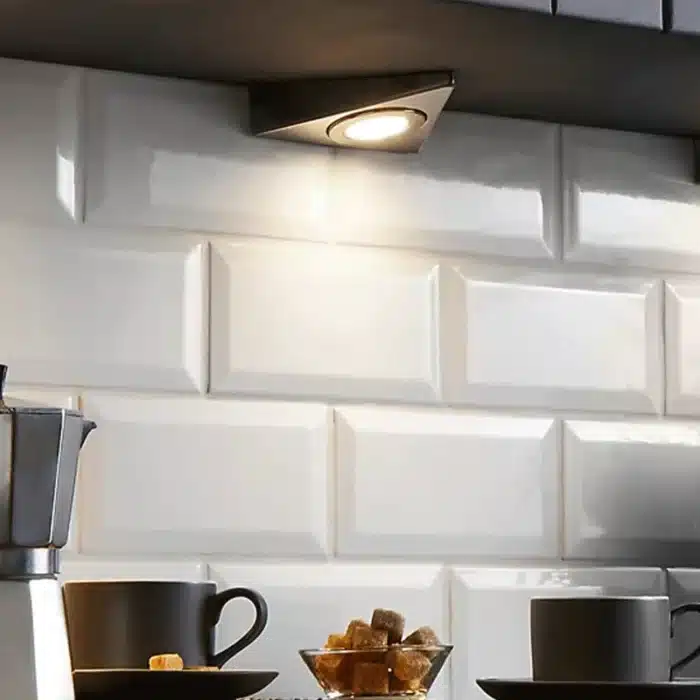 Matt black triangular LED under cabinet light in kitchen