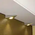 Satin nickel triangular LED under cabinet light in kitchen