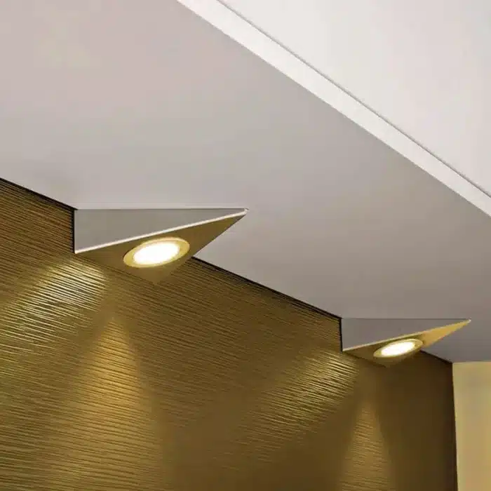 Satin nickel triangular LED under cabinet light in kitchen